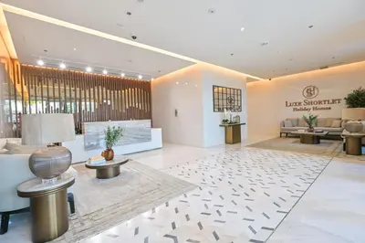 a lobby of a hotel with a waiting room at 1BR by Dubai Crystal Lagoon in District One Meydan in Dubai
