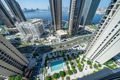 an aerial view of a city with tall buildings at Homes Beyond I 2 BR Apartment with Panoramic Creek View in Dubai