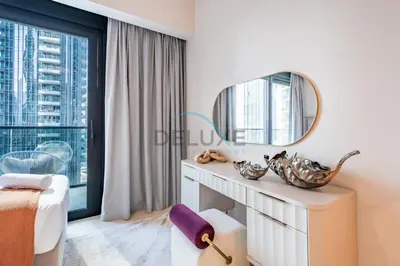 a dressing room with a mirror and a window at Splendid 2BR Apartment at Act One Act Two Tower 2 in Downtown Dubai by Deluxe Holiday Homes in Dubai