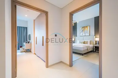 a rendering of a bedroom in a hotel suite at Splendid 2BR Apartment at Act One Act Two Tower 2 in Downtown Dubai by Deluxe Holiday Homes in Dubai