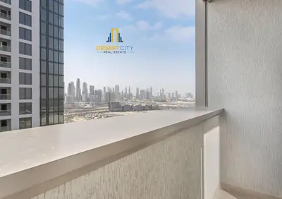 a view of a city from the balcony of a building at Fully Furnished 2 Bed in Sobha Creek Vista Reserve, Hosted by Desert City Stays in Dubai