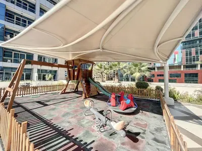 a playground with a slide in a building at Bay Central 1 - One Bed with Stunning Marina View in Dubai