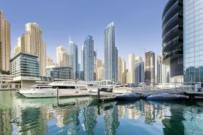 a group of boats docked at a harbor in a city at Bay Central 1 - One Bed with Stunning Marina View in Dubai