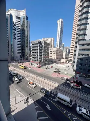 a view of a city street with cars and buildings at Fully Furnished Marina View - 1 Bedroom Apartment in Dubai