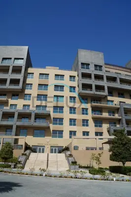 a large apartment building with stairs in front of it at Waterfront 2BR Apartment with Assistant Room in Dream Palm Residence, Palm Jumeirah by Deluxe Holiday Homes in Dubai