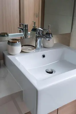 a bathroom sink with two bowls on top of it at Nasma Luxury Stays - Trendy & Stylish Living Studio at Azizi Riviera 41 in Dubai