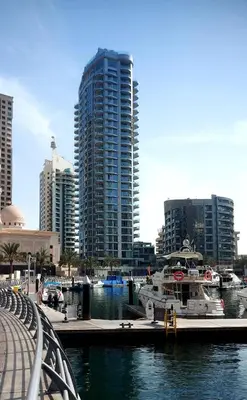 a group of boats docked in a marina with tall buildings at Luxurious Studio Marina View Condor Marina Star in Dubai