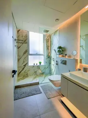 a bathroom with a shower and a toilet and a sink at Luxurious Studio Marina View Condor Marina Star in Dubai