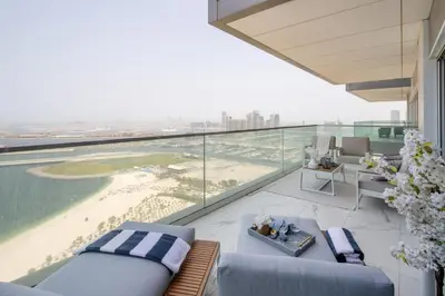 a balcony with a view of the beach and the ocean at Frank Porter - The One JBR in Dubai