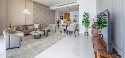 a living room with a couch and a table at Frank Porter - The One JBR in Dubai