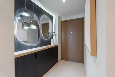 a bathroom with a black vanity and a mirror at Downtown Views Open Burj View 34th Floor 2BD in Dubai