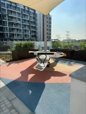 a table sitting on top of a patio at Dubai Galaxy in Azizi Riviera Luxury Studio in Dubai
