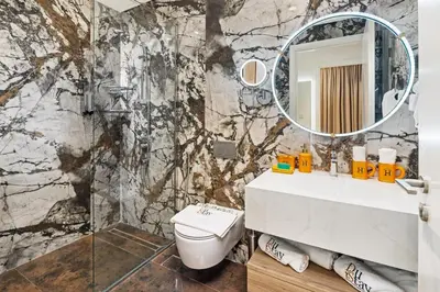 a bathroom with a sink and a mirror at Pool side view at Dubai Creek Harbour by DuStay in Dubai