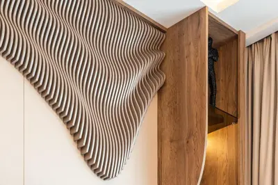 a wall with a parametric design on it at Spacious Apartment - Dubai Creek Harbour by DuStay in Dubai