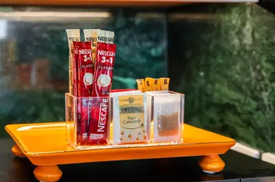 a yellow tray with various items on a table at Spacious Apartment - Dubai Creek Harbour by DuStay in Dubai