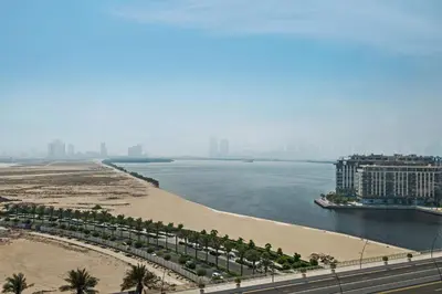 a view of a beach and a body of water at Modern Apartment in Dubai Creek Harbour By DuStay in Dubai