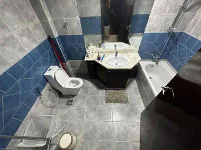 a bathroom with a sink and a toilet and a tub at 2 Bedrooms Apartment with Marina Views in Dubai