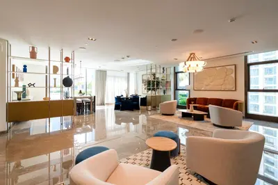 a lobby with chairs and a living room at Iconic 1BR l Boulevard View l Walk to Dubai Mall in Dubai