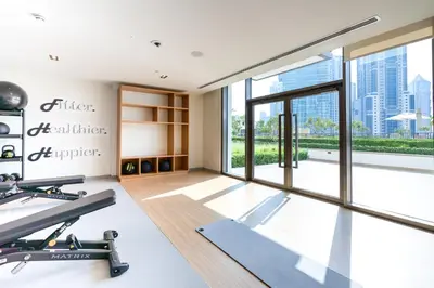 a gym with a view of the city at Iconic 1BR l Boulevard View l Walk to Dubai Mall in Dubai