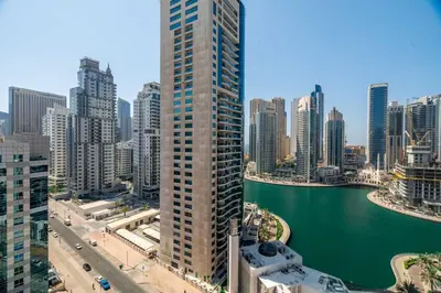 a tall building in a city next to a body of water at GuestReady - Splendid Stay in Dubai Marina in Dubai