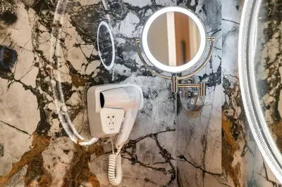 a bathroom with a phone and a mirror at Breathtaking Dubai Skyline view apartment - By DuStay in Dubai