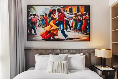 a painting of a dancing couple in a hotel room at Stylish Poolside Apartment in Dubai Creek Harbour - By DuStay in Dubai