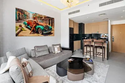 a living room with a couch and a car on the wall at Luxury Getaway Apartment at Dubai Creek Harbour - By Dustay in Dubai