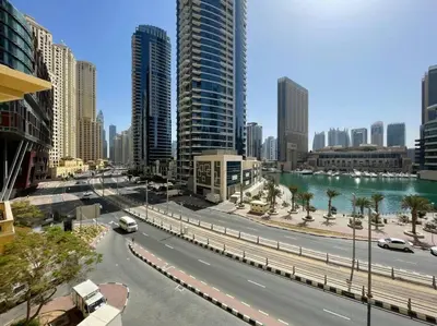 a city street with cars on a road with buildings at The Smart Concierge - Bahar 6 in Dubai