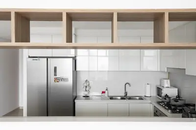 a kitchen with a refrigerator and a sink at Peaceful Dunes 1 - Burj Khalifa & Dubai Mall in Dubai