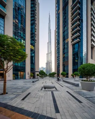 a city street with the burj khalifa in the background at Peaceful Dunes 2 - Near Burj Khalifa & Dubai Mall in Dubai