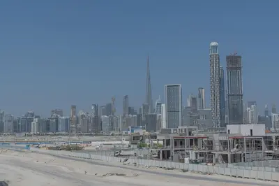a view of a large city with tall buildings at Nasma Luxury Stays - Azizi Riviera 6 Cozy Studio with Burj Khalifa View in Dubai