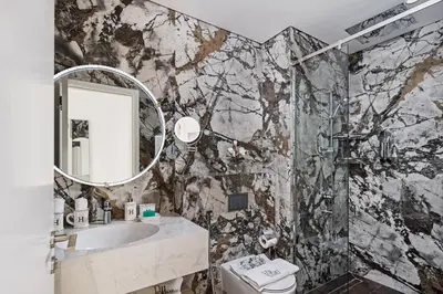 a bathroom with a sink and a mirror at Elegant 2-Bedroom Apartment in Dubai Creek Harbour - By Dustay in Dubai