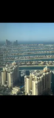 an aerial view of a city with tall buildings at Gorgeous Palm View in Dubai