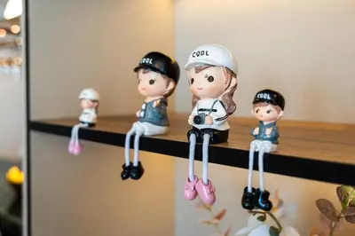 a group of toy dolls on a shelf at Family Friendly luxurious Waterfront Apartment - By Dustay in Dubai