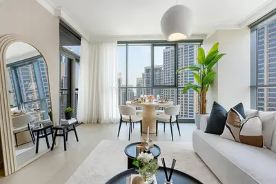 a living room with a couch and a table at Skyline Huge 1 Bedroom Apartment Creek in Dubai