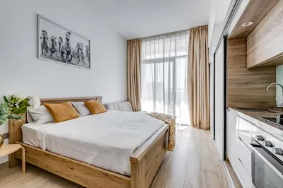 a bedroom with a bed and a large window at Knokey Dubai Marina Comfortable Apartments with Pool and Gym in Dubai
