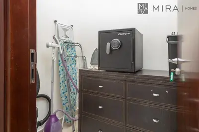 a dresser with a television on top of it at Mira Holiday Homes - Spacious 2 bedroom with patio in Palm Jumeirah in Dubai