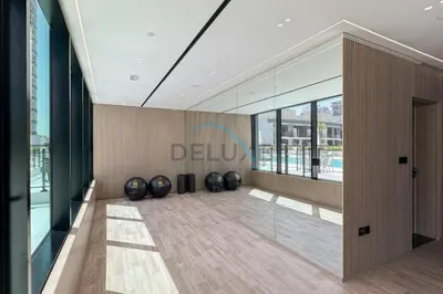 a lobby with a row of black spheres on the floor at Cozy 1BR at Binghatti Corner, Jumeirah Village Circle by Deluxe Holiday Homes in Dubai
