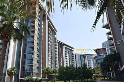 a large apartment building with a sign that reads desert city at Luxurious 2 Bed in Bluewaters, Hosted by Desert City Stays in Dubai