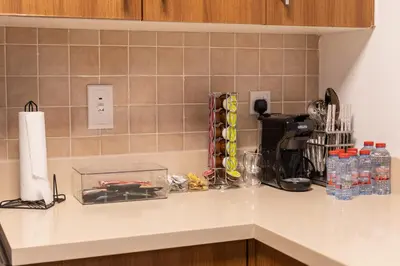 a kitchen counter with a counter top with a counter top at Chic Dubai Marina Stay in Dubai