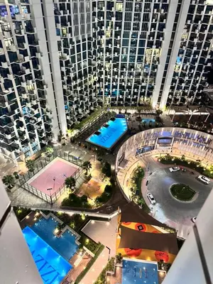 an aerial view of a city with tall buildings at Burj Khalifa view modern 1BHK with balcony in Dubai