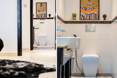 a bathroom with a sink and a toilet at Ultra-Chic 1BR Near Marina & Beach Walk in Dubai
