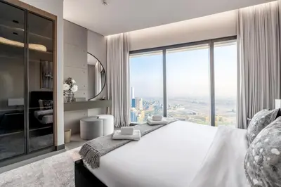 a bedroom with a large white bed with a large window at Address JBR, Beach View, Jumeirah Beach Residence - Mint Stay in Dubai