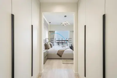 a bedroom with white walls and a bed and a window at Luxurious 2BR Apartment at Sadaf 6, Jumeirah Beach Residence by Deluxe Holiday Homes in Dubai