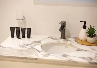 a white counter top with a sink in a bathroom at Princess Tower - Spectacular Sky Views, Palm Jumeirah & JBR Beach in Dubai