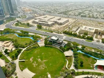 an aerial view of a park in a city at Renovu Exclusive Residences in Dubai in Dubai
