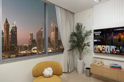 a room with a window with a view of a city at LUXE | 1BR | Heart of DIFC & Trade Centre in Dubai