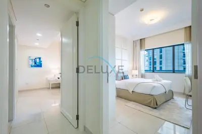 a bedroom with a bed and a large window at Whimsical 3BR at The Signature, Downtown Dubai by Deluxe Holiday Homes in Dubai