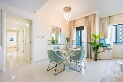 a dining room with a table and chairs at Whimsical 3BR at The Signature, Downtown Dubai by Deluxe Holiday Homes in Dubai