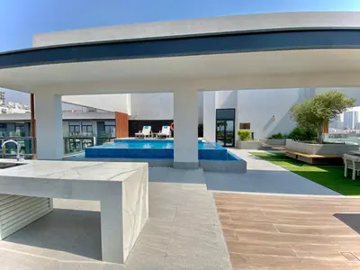 a pool on the roof of a building at Trendy Studio with top Amenities in Dubai